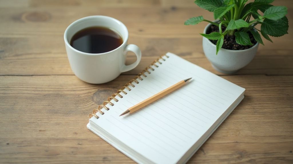 Investing for beginners: A welcoming desk with a notebook, representing the start of financial learning.